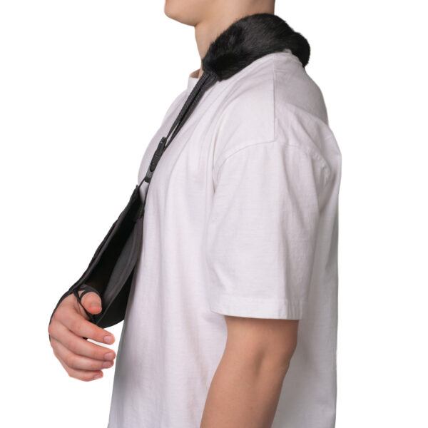 Black arm sling with an adjustable strap and padded support, ensuring comfort during recovery.