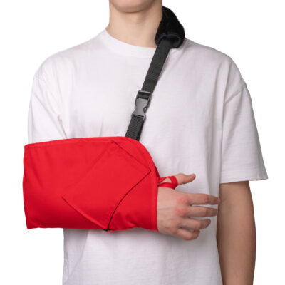 Red arm sling with an adjustable strap and thumb loop for added stability.