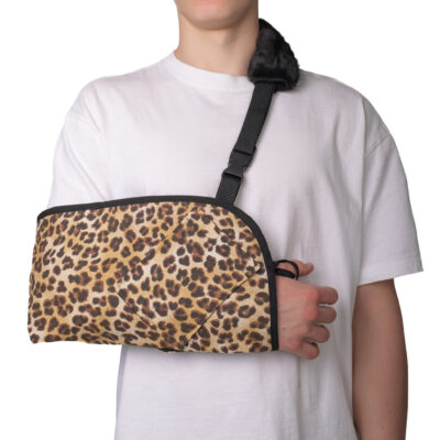 Leopard-print sling with an adjustable strap and thumb loop for added stability.